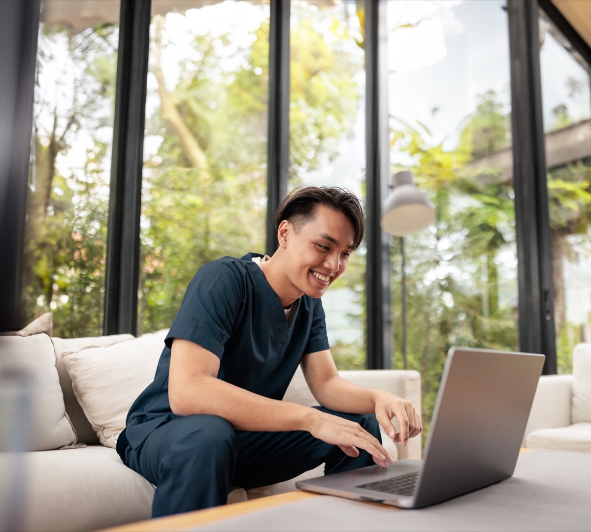 A team member working at a laptop between shifts